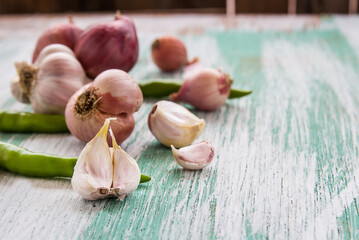 Close up garlic and red onion on wooden table