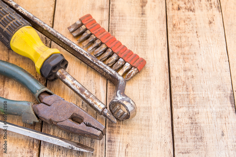 Wall mural close up bunch of used tools on wooden table