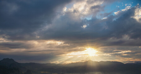 Scenic view dramatic beautiful sunset sky. Natural Sunset Sunrise on meadow silhouette shadow dark land. Vibrant dramatic sky on sunset, dawn, sunrise in Countryside. Landscape Colorful Sky At Sunset