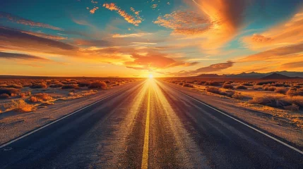  A road stretching across a barren desert landscape at sunset,  symbolizing the perseverance and determination of startups in challenging environments © basketman23