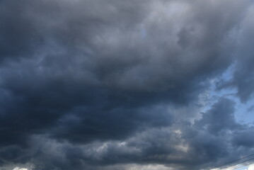 Dramatic dark storm thundercloud rain clouds on black sky background. Dark thunderstorm clouds rainny landscape. Meteorology danger windstorm disaster climate. Dark cloudscape storm disaster gray sky