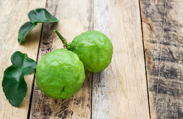 Bergamot on wooden table, (Kaffir lime)