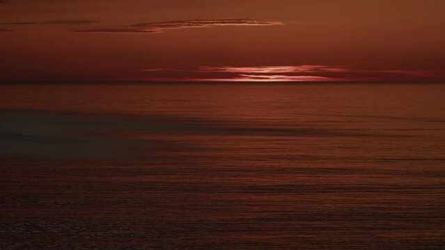 Sunset Red Sky Background At Evening With Clouds. Sunset Over Sea Landscape.