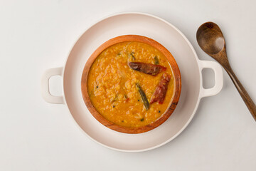 Indian traditional food Mung Dal Tadka Curry served for rice and chapati. Also called Dal Tadka Curry , Dal Sambar, Dal khichadi or Khichdi Tasty Indian recipe made of yellow moong dal.