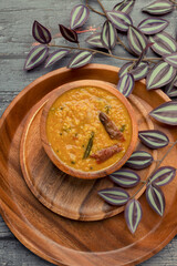 Indian traditional food Mung Dal Tadka Curry served for rice and chapati. Also called Dal Tadka Curry , Dal Sambar, Dal khichadi or Khichdi Tasty Indian recipe made of yellow moong dal.