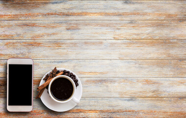 Smart phone and coffee on wooden table