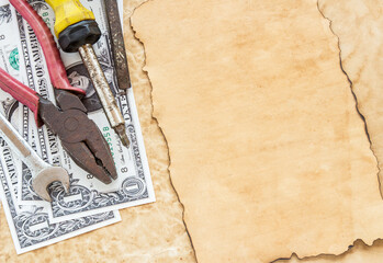 dollar banknotes and tools on old paper background - obrazy, fototapety, plakaty