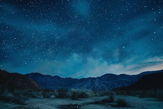 A painting of a night sky with mountains looming in the background, capturing the vastness and beauty of the natural landscape