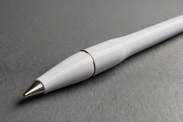 a white pen in a simple single colored background,  bulky pen

