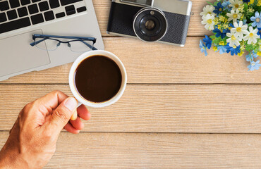  camera and supplies on office wooden desk table