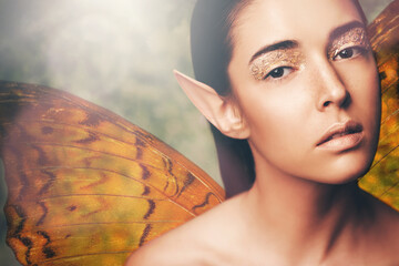 Fairy, woman and wings in nature with makeup, portrait or glow for fantasy, dream or surreal story....