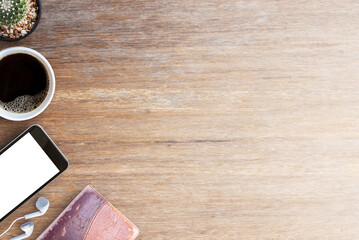 Smart phone and old notebooks with cup of coffee on wood table