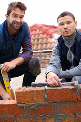 Building, bricklayer and working with industrial tools, maintenance employee with brick wall for...