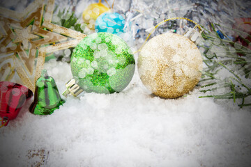 Christmas ball and christmas decorations in the snow.