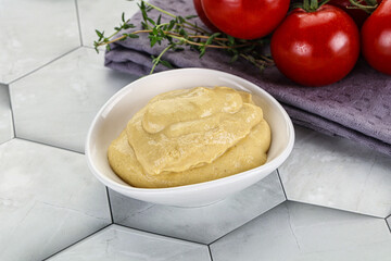 Dijon mustard sauce in the bowl