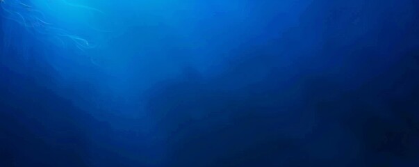 Deep blue ocean panorama with sunlight piercing through the water over a coral reef. - obrazy, fototapety, plakaty