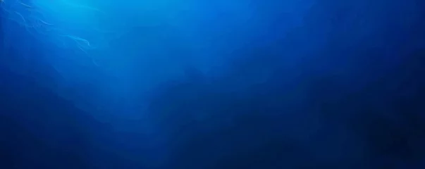 Fotobehang Deep blue ocean panorama with sunlight piercing through the water over a coral reef. © BackgroundWorld