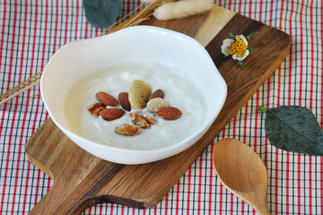 Heathy Meal Plain Yogurt with Nuts in White Bowl