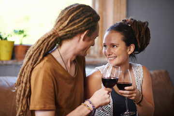 Couple, wine and cheers for love, romance and joy for romantic, dating and relationship together for unwind. Boyfriend, girlfriend and rasta with glass and smile and relax with drink in lounge