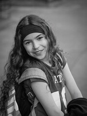 Isolated close up portrait of a young Israeli girl dressed as a football player Purim Purim Jewish Holiday- Israel