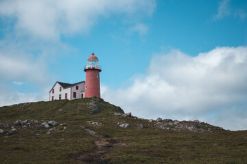 Fototapeta na wymiar Lighthouse in Ferryland, Newfoundland on a cloudy day