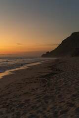 Fototapeta na wymiar Sunset on the beach by the ocean, Nyang Nyang, Bali.