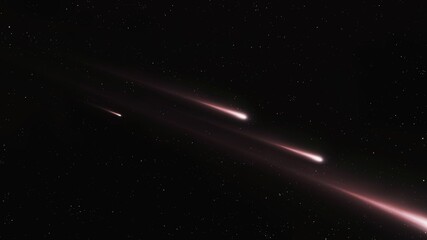 A meteor crashed in the night sky. The meteorite broke into pieces. Fireballs on a black background.