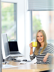 Portrait, business and woman with coffee, happy and professional with computer and relaxing. Face, PR consultant and entrepreneur with morning tea or pc with confidence and creative agency with smile