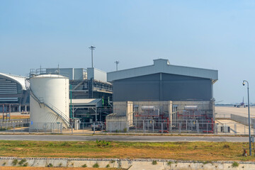 Industrial complex building with a reservoir and pipeline system for the use of water in fire...