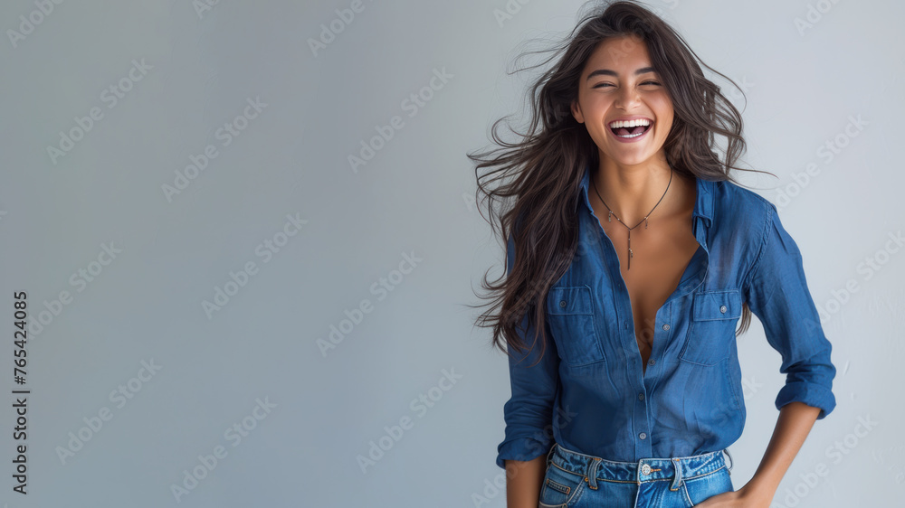 Wall mural Indian woman wear blue shirt smile laugh out loud isolated on grey