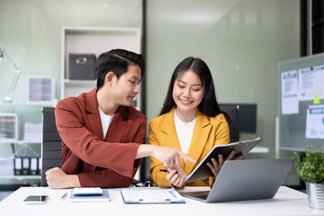 Portrait of success business people working together in office. Couple teamwork startup concept