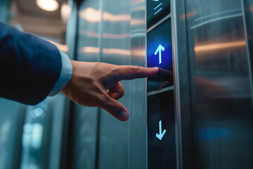 Businessman forefinger pressing elevator up button