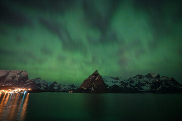 The northern light with snow mountain on Lofoten island ,Norway 