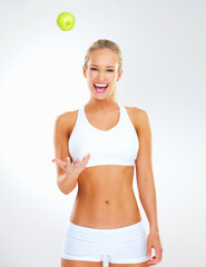 Woman, apple and smile in studio portrait, nutrition and play with fruit on white background. Female person, underwear and organic snack or vegan diet for wellbeing, vitamins and minerals in fiber