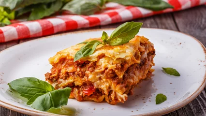 Foto auf Acrylglas Traditional lasagna made with minced beef bolognese sauce © tbralnina
