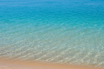 Fototapeta na wymiar blue water and sand