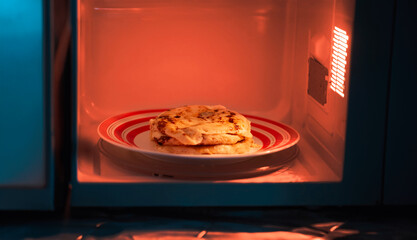 Delicious cheese pupusas, warmed to perfection in a microwave oven, ready to satisfy your cravings...