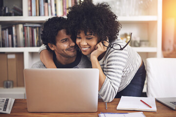Laptop, hugging and couple reading in home office with online blog on internet together. Happy, love and young woman embracing husband and browsing on website with computer at modern apartment.