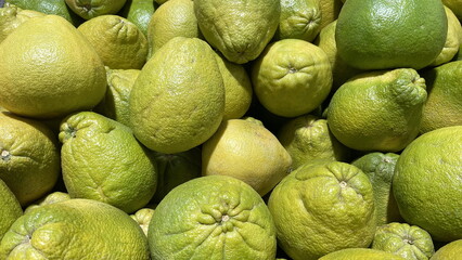 A Cluster of Fresh, Ripened Lemons. Vibrant and Juicy Lemons Offering Aromatic Zest for Culinary...