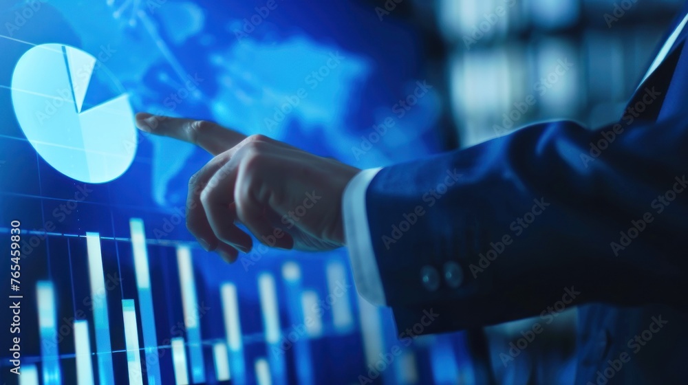 Poster close-up of a business professional's hand pointing at high-tech digital charts and graphs on a futu
