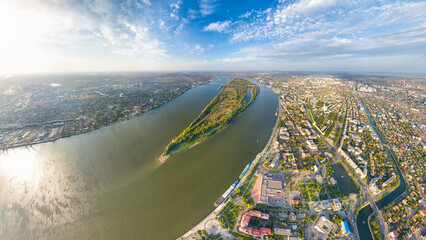 Astrakhan, Russia. Panorama of the city from the air in summer. The Volga River and Gorodstoy Island. Aerial view - obrazy, fototapety, plakaty