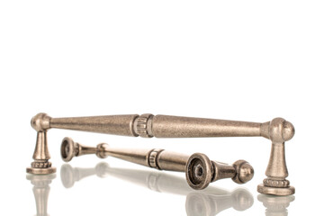 Two metal handles for furniture, macro, isolated on white background.