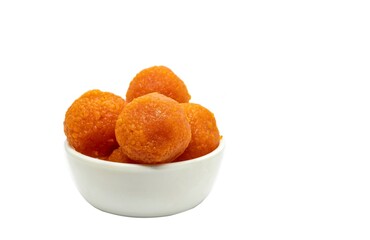 Motichoor Laddu or Motichur Laddoo in a White Bowl Isolated on White Background with Copy Space