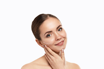 Beautiful Woman With Face Cream. Skin Protection. SkinCare. Spa. A Young Female Holds Moisturizing Cream and Smiling. Natural Makeup