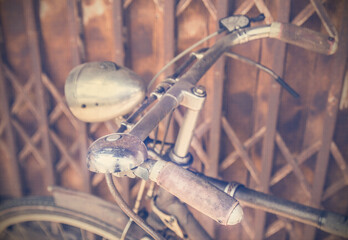 Vintage bicycle against an old metal wall