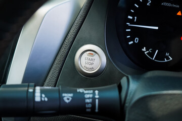 Close up engine car start button. Start stop engine modern new car button,Makes it easy to turn your auto mobile on and off. a key fob unique ,selective focus	
