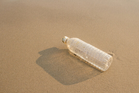 Plastic bottles on the beach sand