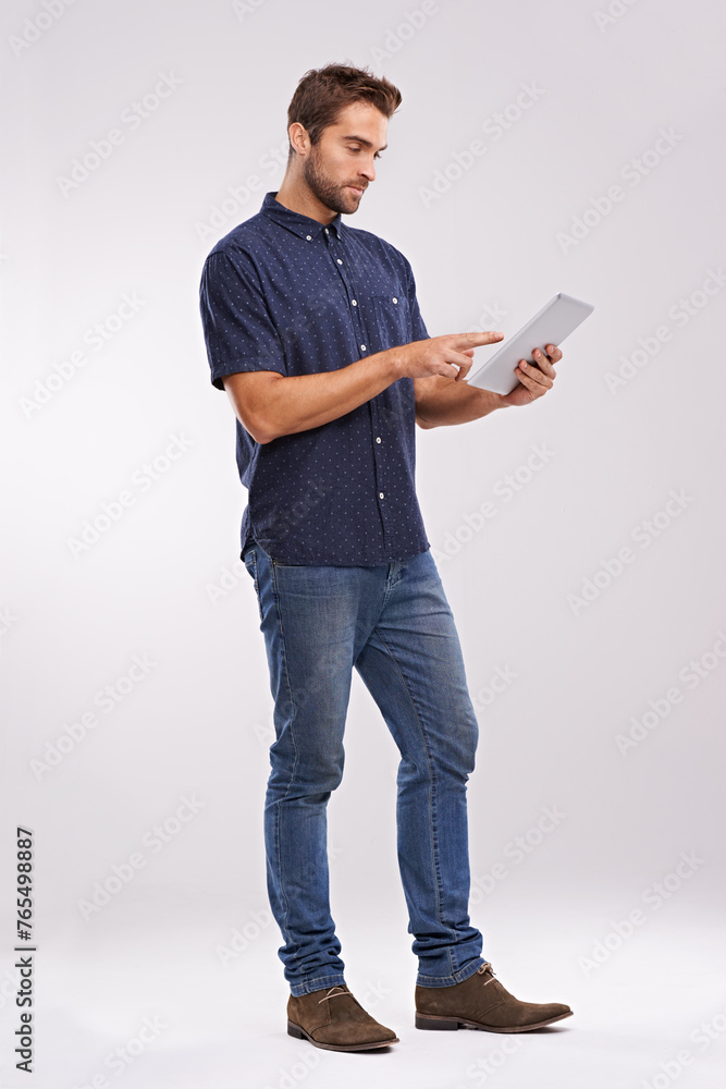 Aufkleber Man, tablet and scroll with internet connection in studio for website technology for connectivity, online or white background. Male person, network and digital browsing for email, streaming or mockup