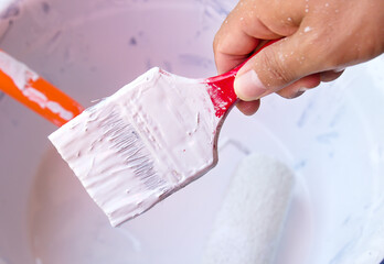Man hand holder with paint brush