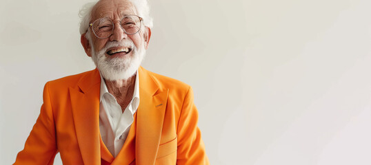 A man in an orange suit is smiling and looking at the camera. Concept of happiness. old handsome man in an orange suit person but at 80 years old, he is very energetic and happy, in a white background